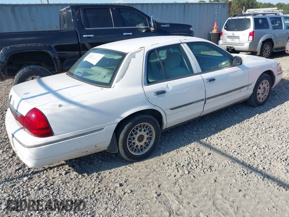 2004 Mercury Grand Marquis GS z VIN 2MEFM74W74X654151, wystawiony jako IAAI lot #42185493 z przebiegiem 203 017 mil mil oraz . Historia ofert i sprzedaży dostępna na DreamBid. Obrazek 4.