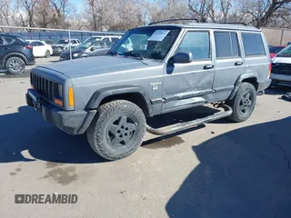 1997 Jeep Cherokee Sport with VIN 1J4FJ68S4VL567490, listed as a IAAI auction lot 41659872 with 404,766 mi miles. Bid and sale history available at carsss.com. Image 2.