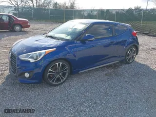2016 Hyundai Veloster Turbo with VIN KMHTC6AE4GU260112, listed as a IAAI auction lot 41868273 with 130,853 mi miles. Bid and sale history available at carsss.com. Image 2.