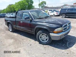 2004 Dodge Dakota SLT with VIN 1D7GL42K64S657235, listed as a IAAI auction lot 42121847 with 157,557 mi miles and . Bid and sale history available at DreamBid. Image 1.