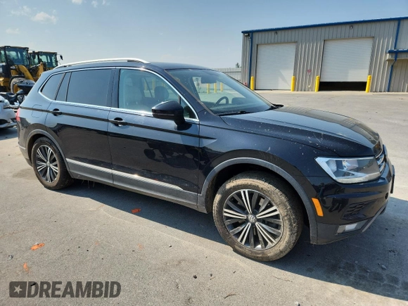 2018 Volkswagen Tiguan SEL with VIN 3VV2B7AX5JM015388, listed as a Copart auction lot 60222195 with 121,389 mi miles and Salvage title. Bid and sale history available at DreamBid. Image 4.