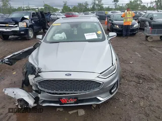2020 Ford Fusion Titanium with VIN 3FA6P0D98LR115437, listed as a IAAI auction lot 42331052 with 127,346 mi miles and . Bid and sale history available at DreamBid. Image 12.