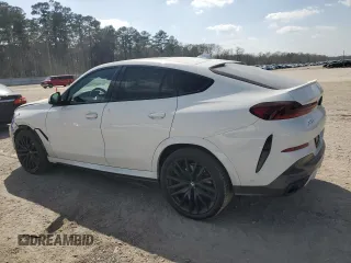 2022 BMW X6 xDrive40i z VIN 5UXCY6C0XN9K78927, wystawiony jako Copart lot #48348335 z przebiegiem 63 074 mil mil oraz Szkoda całkowita • Salvage title. Historia ofert i sprzedaży dostępna na DreamBid. Obrazek 2.