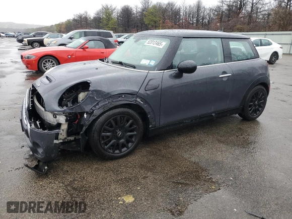 2014 MINI Hardtop S with VIN WMWXM7C54ET985344, listed as a Copart auction lot 52012465 with 87,017 mi miles and Salvage title. Bid and sale history available at DreamBid. Image 1.