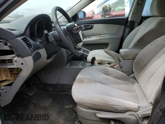 2010 Kia Optima LX z VIN KNAGG4A86A5451165, wystawiony jako Copart lot #52763415 z przebiegiem 213 958 mil mil oraz Szkoda całkowita • Salvage title. Historia ofert i sprzedaży dostępna na DreamBid. Obrazek 7.