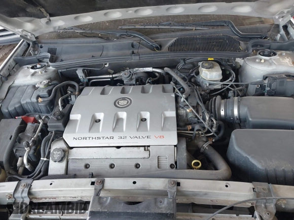 2003 Cadillac DeVille DTS z VIN 1G6KF57943U114611, wystawiony jako IAAI lot #41661350 z przebiegiem 160 762 mil mil oraz . Historia ofert i sprzedaży dostępna na DreamBid. Obrazek 10.