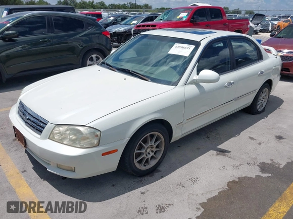 2002 Kia Optima LX z VIN KNAGD126325144218, wystawiony jako IAAI lot #42596691 z przebiegiem 220 972 mil mil oraz . Historia ofert i sprzedaży dostępna na DreamBid. Obrazek 2.