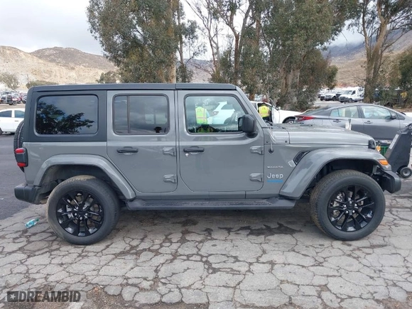 2021 Jeep Wrangler 4xe Unlimited Sahara with VIN 1C4JJXP64MW720263, listed as a IAAI auction lot 41514302 with 73,300 mi miles. Bid and sale history available at carsss.com. Image 14.