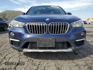 2018 BMW X1 sDrive28i with VIN WBXHU7C30J5H42351, listed as a Copart auction lot 49173875 with 139,084 mi miles and Clean Title. Bid and sale history available at carsss.com. Image 5.