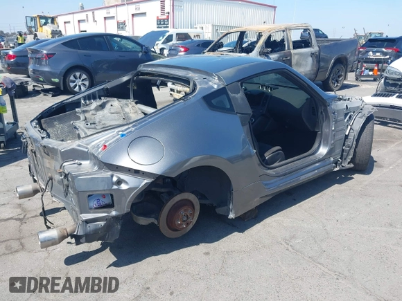 2014 Nissan 370Z Nismo with VIN JN1AZ4EH9EM632501, listed as a IAAI auction lot 39504585 with Not Provided miles and . Bid and sale history available at DreamBid. Image 4.