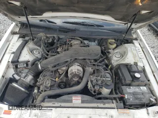 1995 Mercury Cougar z VIN 1MELM62W1SH624477, wystawiony jako Copart lot #56720625 z przebiegiem 156 034 mil mil oraz Szkoda całkowita • Salvage title. Historia ofert i sprzedaży dostępna na DreamBid. Obrazek 11.