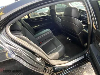 2012 BMW 7 Series 740Li with VIN WBAKB4C55CC576166, listed as a Copart auction lot 52448115 with 154,949 mi miles and Clean Title. Bid and sale history available at carsss.com. Image 6.