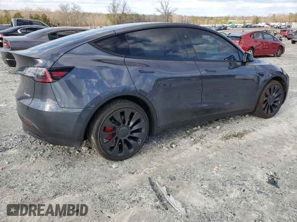 2023 Tesla Model Y Performance with VIN 7SAYGDEF4PF920859, listed as a Copart auction lot 89136705 with 8,148 mi miles and Salvage Title. Bid and sale history available at DreamBid. Image 3.