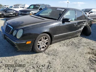2001 Mercedes-Benz E-Class AWD with VIN WDBJF82JX1X044733, listed as a Copart auction lot 74825034 with 153,046 mi miles and Salvage Title. Bid and sale history available at carsss.com. Image 1.