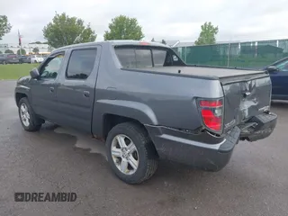 2014 Honda Ridgeline RTL with VIN 5FPYK1F5XEB011772, listed as a IAAI auction lot 42440390 with 145,219 mi miles and . Bid and sale history available at DreamBid. Image 3.