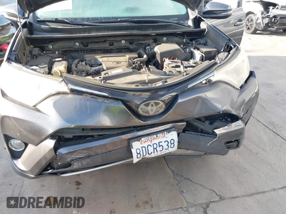 2018 Toyota RAV4 XLE with VIN JTMWFREV6JJ175575, listed as a IAAI auction lot 41788004 with 112,577 mi miles. Bid and sale history available at carsss.com. Image 6.