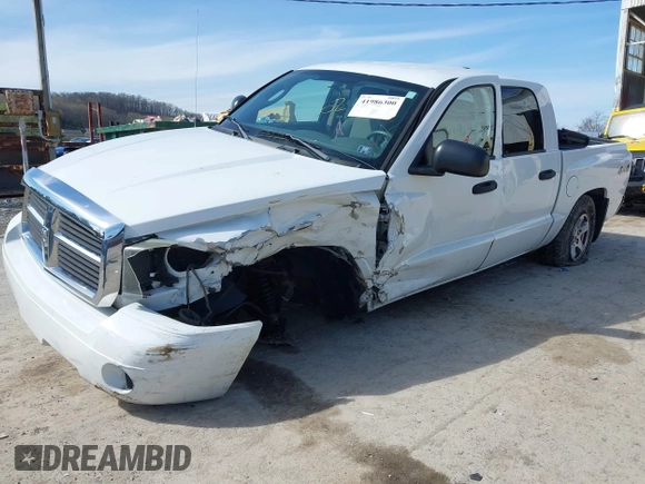 2006 Dodge Dakota SLT z VIN 1D7HW48K06S676241, wystawiony jako IAAI lot #41986300 z przebiegiem 112 215 mil mil oraz . Historia ofert i sprzedaży dostępna na DreamBid. Obrazek 6.