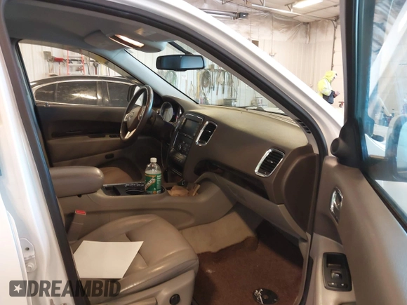 2013 Dodge Durango Crew with VIN 1C4RDHDG5DC553913, listed as a IAAI auction lot 42227189 with 209,703 mi miles and . Bid and sale history available at DreamBid. Image 5.