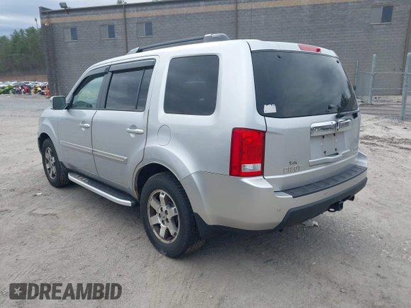 2011 Honda Pilot Touring with VIN 5FNYF4H90BB022354, listed as a IAAI auction lot 41965082 with 126,505 mi miles and . Bid and sale history available at carsss.com. Image 3.