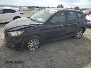 2016 Mazda CX-5 Sport with VIN JM3KE2BYXG0675767, listed as a Copart auction lot 52738615 with 137,496 mi miles and Salvage title. Bid and sale history available at DreamBid. Image 1.