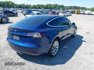 2019 Tesla Model 3 Mid Range with VIN 5YJ3E1EA6KF402308, listed as a IAAI auction lot 40077902 with 89,794 mi miles and . Bid and sale history available at carsss.com. Image 4.