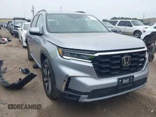 2023 Honda Pilot Touring with VIN 5FNYG2H75PB014662, listed as a IAAI auction lot 41889246 with 14,413 mi miles. Bid and sale history available at carsss.com. Image 1.