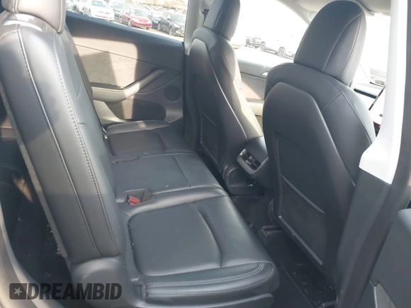 2023 Tesla Model Y Long Range with VIN 7SAYGAEEXPF612231, listed as a IAAI auction lot 41758243 with 32,924 mi miles and . Bid and sale history available at DreamBid. Image 8.