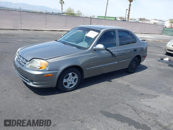 2003 Hyundai Accent GL with VIN KMHCG45C73U471607, listed as a IAAI auction lot 41956551 with 222,305 mi miles. Bid and sale history available at carsss.com. Image 12.