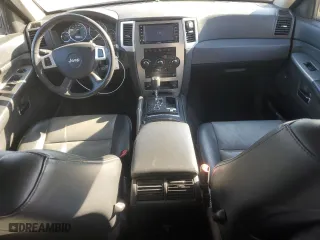 2010 Jeep Grand Cherokee Laredo with VIN 1J4RR4GT1AC106990, listed as a Copart auction lot 87421664 with 106,025 mi miles and Salvage Title. Bid and sale history available at carsss.com. Image 8.