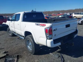 2021 Toyota Tacoma 4WD SR5 with VIN 3TYDZ5BN4MT000619, listed as a IAAI auction lot 41886686 with 91,338 mi miles. Bid and sale history available at carsss.com. Image 3.