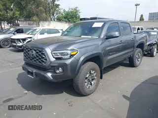 2023 Toyota Tacoma SR with VIN 3TMCZ5AN0PM635933, listed as a IAAI auction lot 42543126 with 32,960 mi miles and . Bid and sale history available at DreamBid. Image 2.