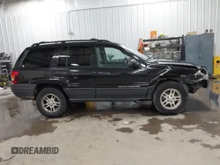 2004 Jeep Grand Cherokee Laredo with VIN 1J4GW48N84C367215, listed as a IAAI auction lot 41352098 with 165,485 mi miles and . Bid and sale history available at DreamBid. Image 13.