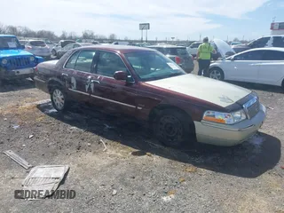 2003 Mercury Grand Marquis LS Premium z VIN 2MEFM75W73X650193, wystawiony jako IAAI lot #41803310 z przebiegiem 151 719 mil mil oraz . Historia ofert i sprzedaży dostępna na DreamBid. Obrazek 1.
