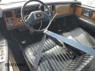 1985 Cadillac Eldorado z VIN 1G6EL578XFE614641, wystawiony jako Copart lot #75663984 z przebiegiem 54 128 mil mil oraz Szkody całkowita. Historia ofert i sprzedaży dostępna na DreamBid. Obrazek 8.