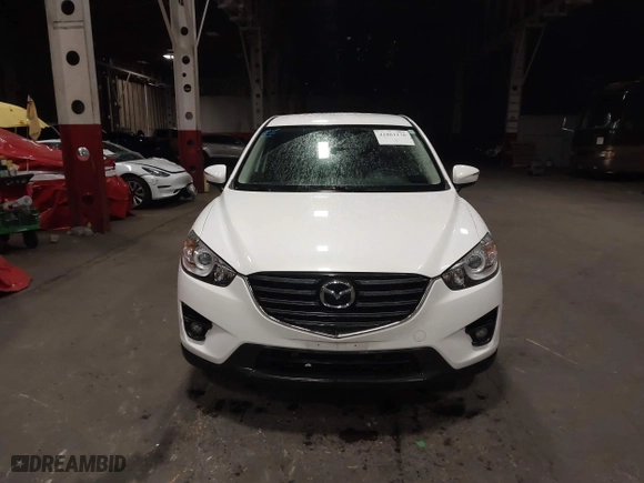 2016 Mazda CX-5 Touring with VIN JM3KE4CY0G0853261, listed as a IAAI auction lot 41861176 with 63,491 mi miles. Bid and sale history available at carsss.com. Image 12.