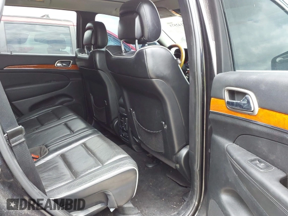 2013 Jeep Grand Cherokee Overland with VIN 1C4RJECT2DC588124, listed as a IAAI auction lot 42142573 with 204,309 mi miles and . Bid and sale history available at DreamBid. Image 8.