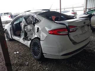 2017 Ford Fusion Hybrid Titanium with VIN 3FA6P0RU1HR322997, listed as a IAAI auction lot 41506630 with 263,589 mi miles and . Bid and sale history available at DreamBid. Image 3.
