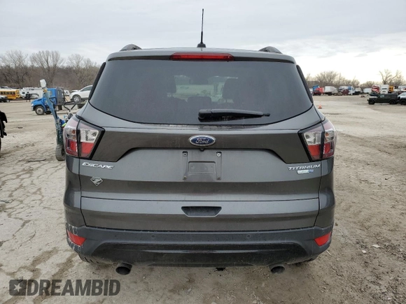 2017 Ford Escape Titanium with VIN 1FMCU9J99HUB79870, listed as a Copart auction lot 47469655 with 58,683 mi miles and Salvage Title. Bid and sale history available at carsss.com. Image 6.