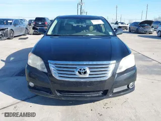 2009 Toyota Avalon XL with VIN 4T1BK36B89U335604, listed as a IAAI auction lot 41328877 with 166,396 mi miles. Bid and sale history available at carsss.com. Image 6.