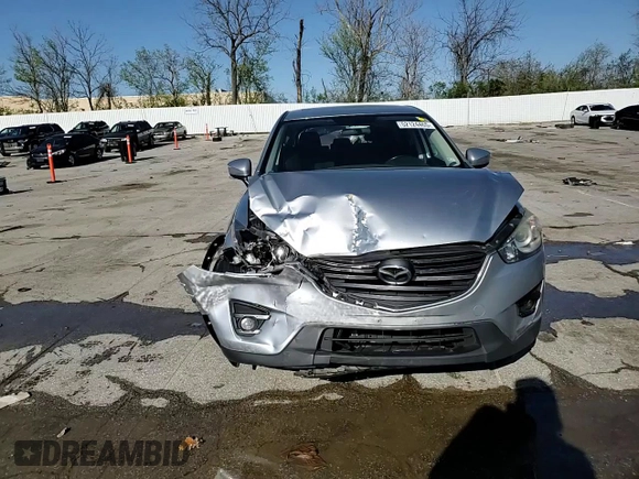 2016 Mazda CX-5 Touring with VIN JM3KE2CY8G0614335, listed as a Copart auction lot 52124465 with 218,320 mi miles and Salvage Title. Bid and sale history available at carsss.com. Image 12.