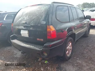 2006 GMC Envoy SLT with VIN 1GKDS13S562199496, listed as a IAAI auction lot 41463065 with 219,473 mi miles. Bid and sale history available at carsss.com. Image 4.