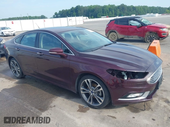 2017 Ford Fusion Titanium z VIN 3FA6P0K94HR271307, wystawiony jako IAAI lot #42595411 z przebiegiem 100 344 mil mil oraz . Historia ofert i sprzedaży dostępna na DreamBid. Obrazek 1.