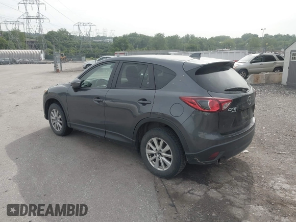 2014 Mazda CX-5 Touring z VIN JM3KE4CY2E0348500, wystawiony jako IAAI lot #42318155 z przebiegiem 182 616 mil mil oraz . Historia ofert i sprzedaży dostępna na DreamBid. Obrazek 3.