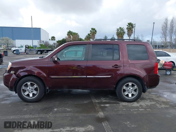 2009 Honda Pilot Touring with VIN 5FNYF48959B007813, listed as a IAAI auction lot 41823645 with 200,571 mi miles and . Bid and sale history available at carsss.com. Image 14.