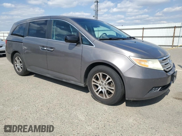 2011 Honda Odyssey EX-L with VIN 5FNRL5H61BB056652, listed as a Copart auction lot 54774015 with 233,125 mi miles and Salvage Title. Bid and sale history available at DreamBid. Image 4.