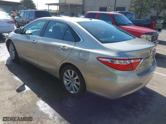 2015 Toyota Camry Hybrid LE with VIN 4T1BD1FK1FU174975, listed as a IAAI auction lot 42085034 with 54,728 mi miles. Bid and sale history available at carsss.com. Image 3.