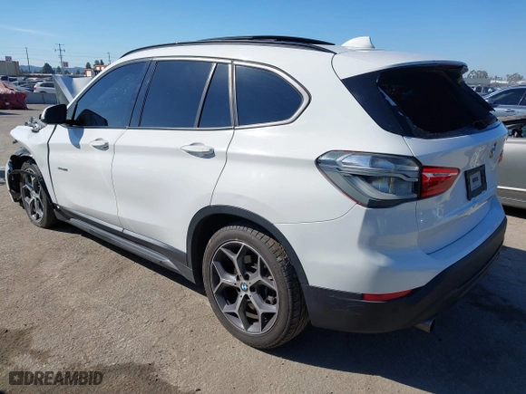 2016 BMW X1 xDrive28i with VIN WBXHT3C32G5E51855, listed as a IAAI auction lot 41634237 with 69,101 mi miles. Bid and sale history available at carsss.com. Image 3.
