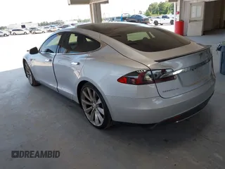 2013 Tesla Model S Performance with VIN 5YJSA1DP6DFP07999, listed as a IAAI auction lot 42284612 with 123,261 mi miles and . Bid and sale history available at DreamBid. Image 3.