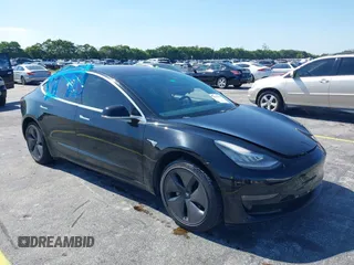 2019 Tesla Model 3 Mid Range with VIN 5YJ3E1EA0KF317058, listed as a IAAI auction lot 42025195 with 108,771 mi miles. Bid and sale history available at carsss.com. Image 1.