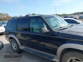 2000 Ford Explorer Eddie Bauer z VIN 1FMZU64EXYZA74923, wystawiony jako IAAI lot #41504088 z przebiegiem 254 021 mil mil oraz . Historia ofert i sprzedaży dostępna na DreamBid. Obrazek 13.